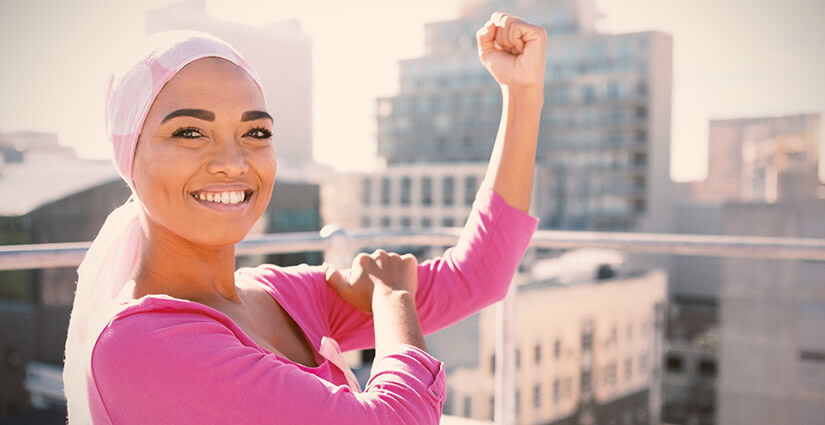 Breast cancer survivor proud standing in sunshine
